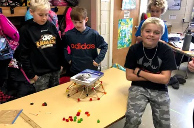 students building with connect sticks
